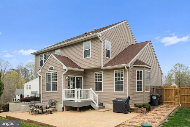 63 Woodleigh Ln, Stafford, VA 22556 - back of house with roof with shingles, fence, and a patio area