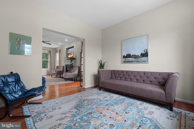 63 Woodleigh Ln, Stafford, VA 22556 - living area with baseboards, ceiling fan, wood finished floors, and a glass covered fireplace