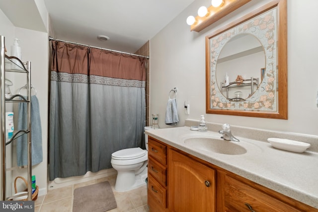 full bathroom featuring curtained shower, toilet, tile patterned flooring, and vanity