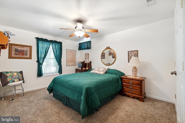 bedroom with baseboards, visible vents, ceiling fan, and carpet floors