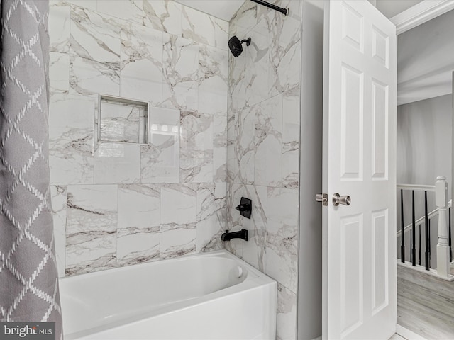 bathroom with bathing tub / shower combination