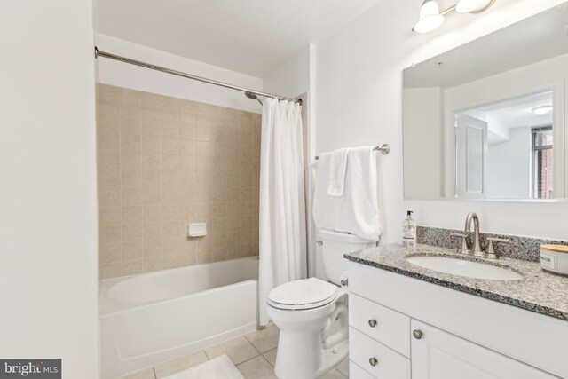 full bathroom with toilet, shower / bath combo with shower curtain, tile patterned flooring, and vanity