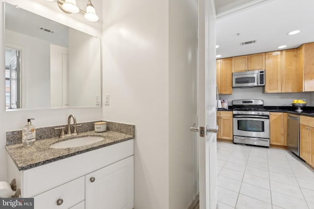 bathroom with tile patterned floors, visible vents, vanity, and recessed lighting