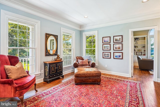 living area featuring recessed lighting, wood finished floors, and ornamental molding
