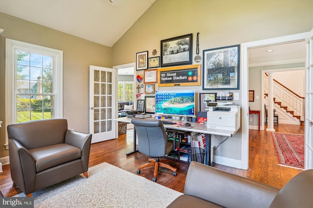 office with high vaulted ceiling, baseboards, french doors, and wood finished floors