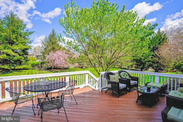 wooden deck featuring outdoor lounge area and outdoor dining area