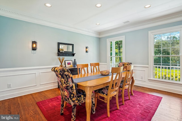 dining area with wainscoting, ornamental molding, and recessed lighting