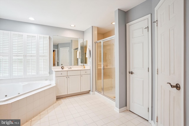 full bathroom with a stall shower, recessed lighting, tile patterned flooring, a tub with jets, and vanity