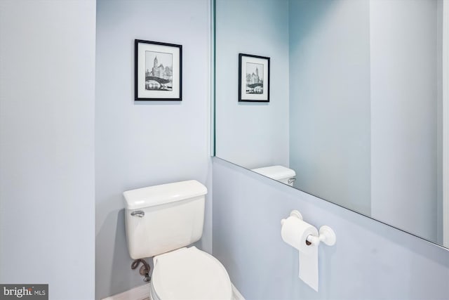 half bath featuring toilet