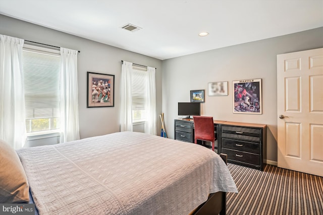 bedroom featuring recessed lighting, visible vents, and carpet