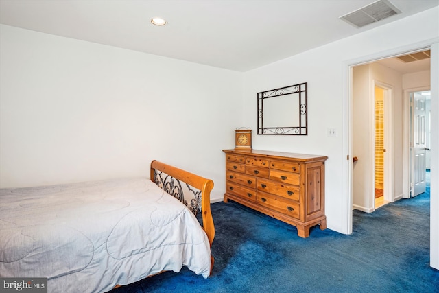 carpeted bedroom featuring recessed lighting, visible vents, and baseboards
