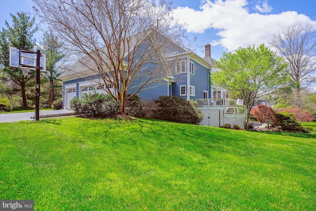 exterior space with driveway and a garage