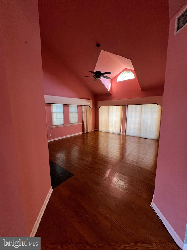 122 Lahinch Ct, Middletown, DE 19709 - empty room with visible vents, baseboards, ceiling fan, wood finished floors, and vaulted ceiling