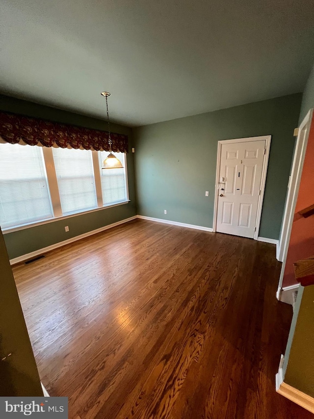 122 Lahinch Ct, Middletown, DE 19709 - unfurnished dining area with baseboards, visible vents, and wood finished floors