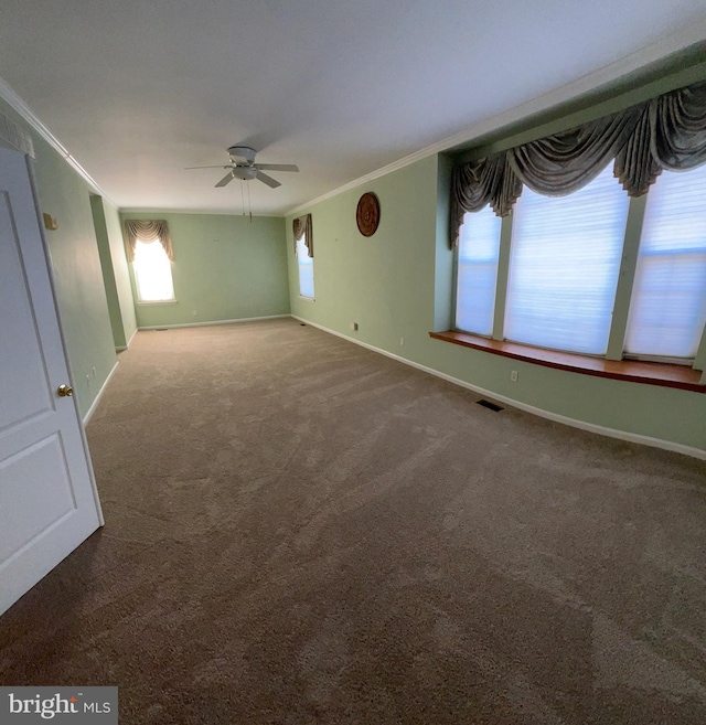 122 Lahinch Ct, Middletown, DE 19709 - empty room featuring carpet floors, baseboards, visible vents, ceiling fan, and ornamental molding