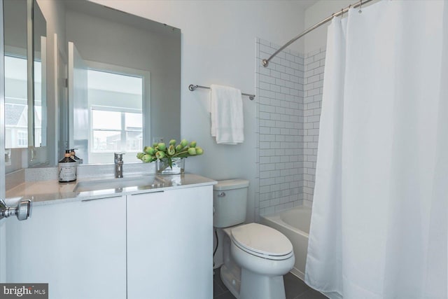 bathroom featuring toilet, vanity, and shower / tub combo with curtain