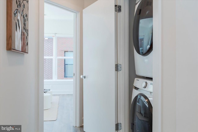washroom with laundry area and stacked washer and clothes dryer