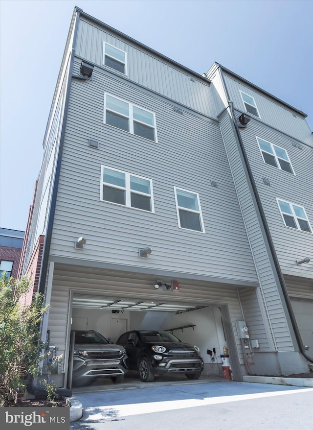 back of property with a garage