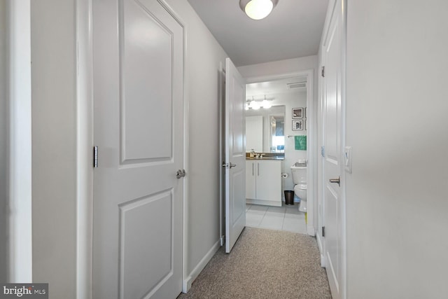 1021 N Garfield St Unit 831, Arlington, VA 22201 - hallway featuring light tile patterned floors and light carpet