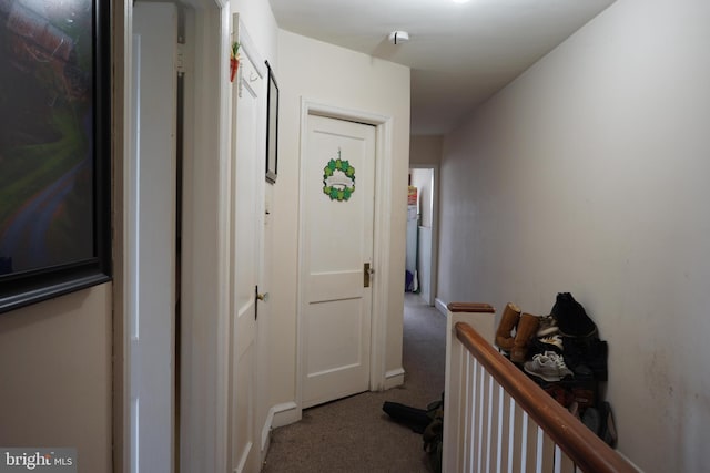 hallway with carpet flooring