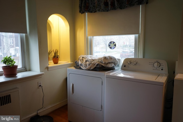 washroom featuring laundry area and separate washer and dryer