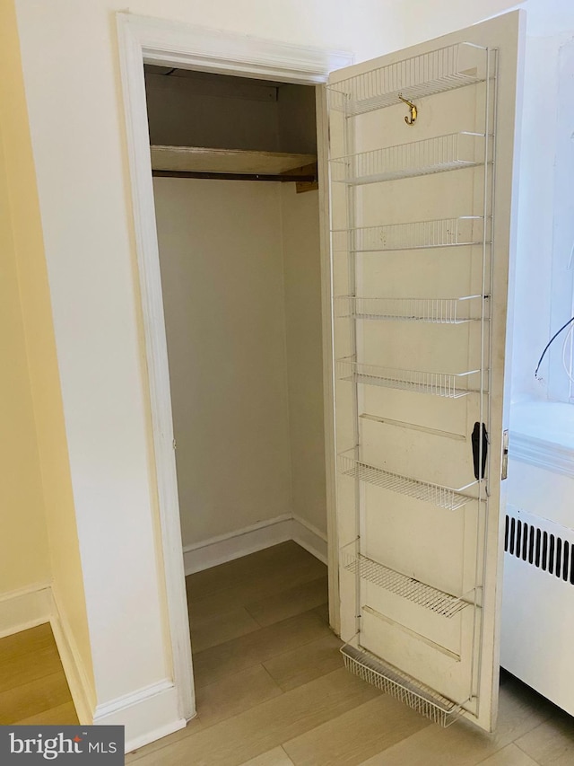 closet with radiator heating unit