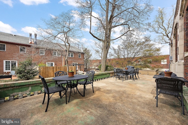 view of patio / terrace featuring fence and outdoor dining space