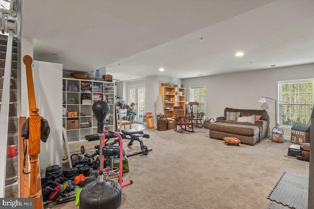 exercise area featuring carpet floors and recessed lighting