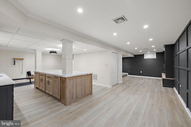 interior space featuring visible vents, recessed lighting, light wood finished floors, and crown molding