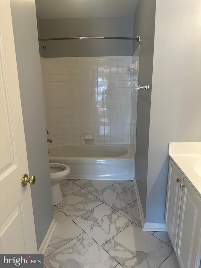 bathroom featuring baseboards, marble finish floor, toilet, and vanity