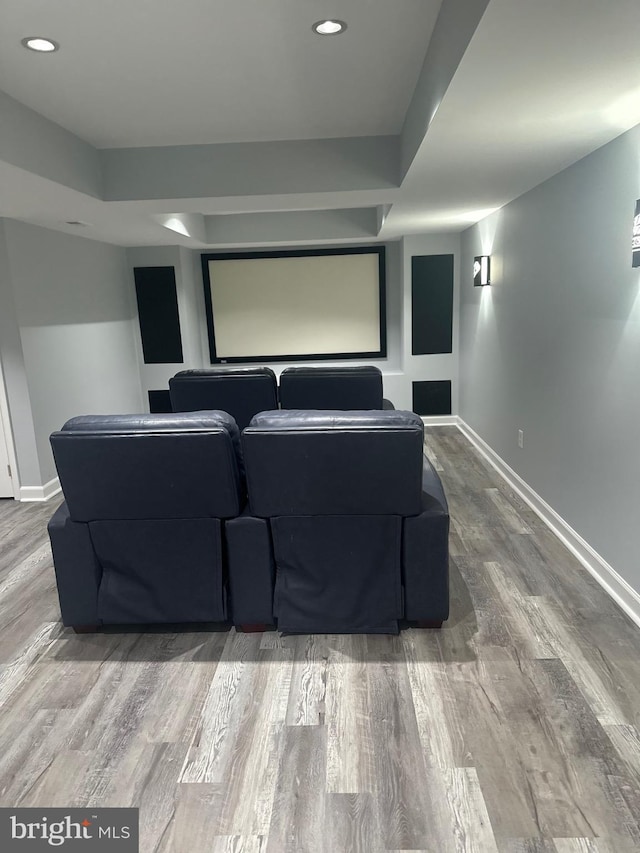 home theater with baseboards, recessed lighting, and wood finished floors