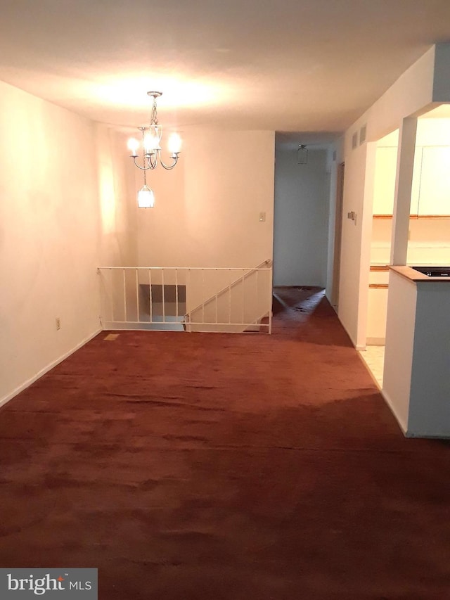 unfurnished dining area featuring visible vents and a notable chandelier