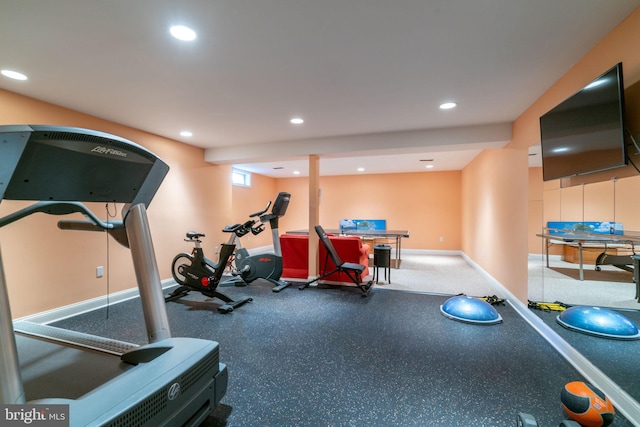 exercise room featuring baseboards and recessed lighting