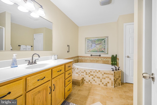 full bathroom with a garden tub and vanity