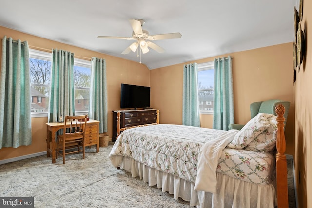 carpeted bedroom featuring ceiling fan and baseboards