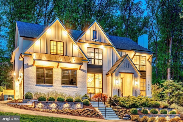 1544 Forest Villa Ln, Mclean, VA 22101 - view of front of home with board and batten siding, a chimney, roof with shingles, and brick siding