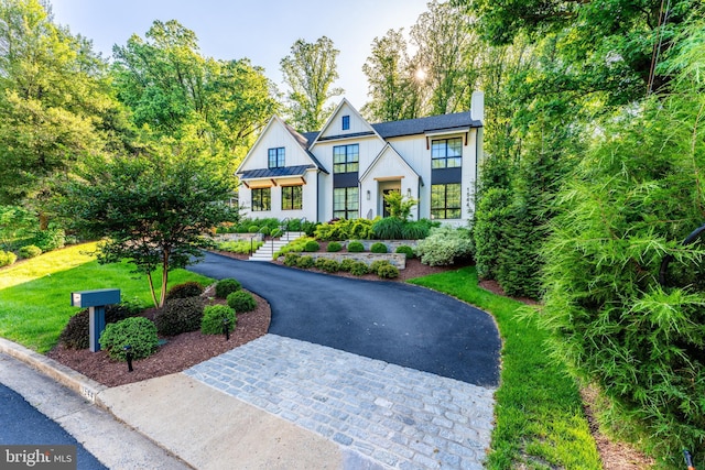 1544 Forest Villa Ln, Mclean, VA 22101 - view of front of property with a chimney, asphalt driveway, a standing seam roof, metal roof, and a front yard