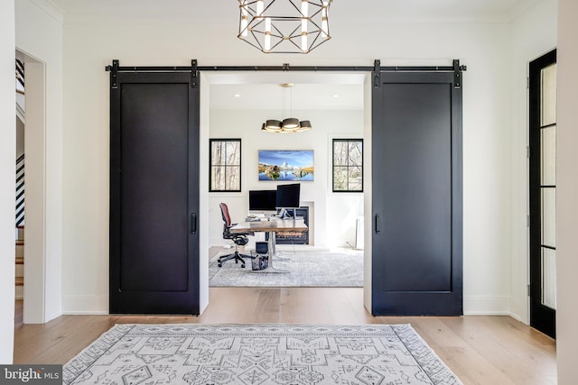 1544 Forest Villa Ln, Mclean, VA 22101 - home office with a barn door, wood finished floors, baseboards, and ornamental molding
