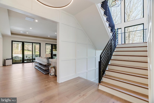 1544 Forest Villa Ln, Mclean, VA 22101 - stairway featuring a decorative wall, wood finished floors, and recessed lighting