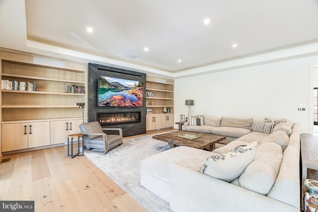 1544 Forest Villa Ln, Mclean, VA 22101 - living room with light wood-style flooring, built in features, a fireplace, a tray ceiling, and recessed lighting