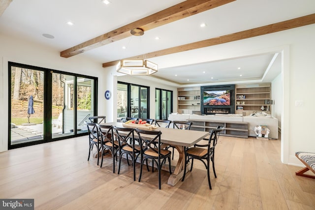 1544 Forest Villa Ln, Mclean, VA 22101 - dining area with light wood-type flooring, beam ceiling, recessed lighting, and a warm lit fireplace