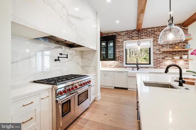 1544 Forest Villa Ln, Mclean, VA 22101 - kitchen with double oven range, a sink, white cabinetry, light wood-style floors, and beamed ceiling