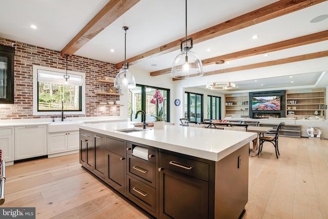 1544 Forest Villa Ln, Mclean, VA 22101 - kitchen featuring light countertops, a sink, light wood-style flooring, beamed ceiling, and recessed lighting