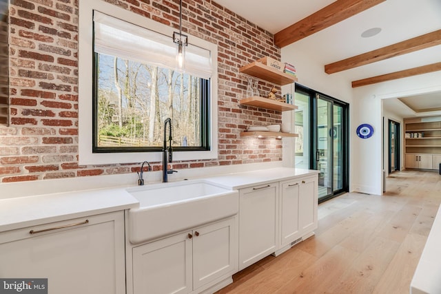 1544 Forest Villa Ln, Mclean, VA 22101 - kitchen with a sink, plenty of natural light, white cabinets, light countertops, and beam ceiling