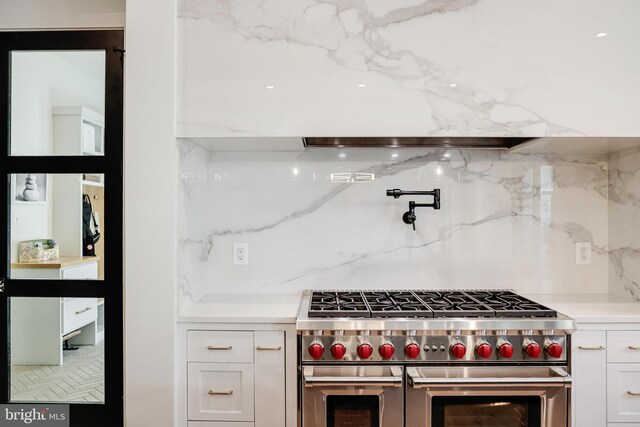 1544 Forest Villa Ln, Mclean, VA 22101 - kitchen with range with two ovens, white cabinetry, light countertops, and backsplash
