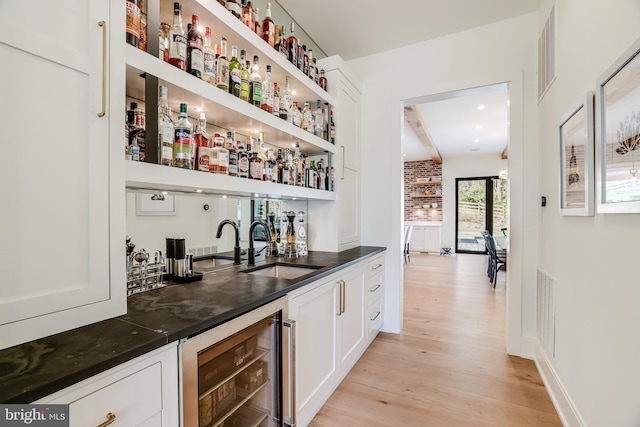 1544 Forest Villa Ln, Mclean, VA 22101 - indoor wet bar featuring wine cooler, light wood-type flooring, and beamed ceiling