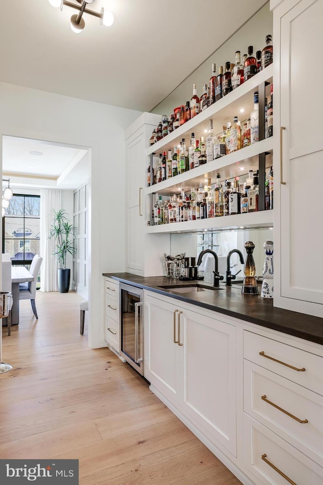 1544 Forest Villa Ln, Mclean, VA 22101 - indoor wet bar featuring wine cooler and light wood-type flooring