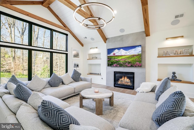 1544 Forest Villa Ln, Mclean, VA 22101 - living area with a chandelier, built in features, wood finished floors, beam ceiling, and a large fireplace