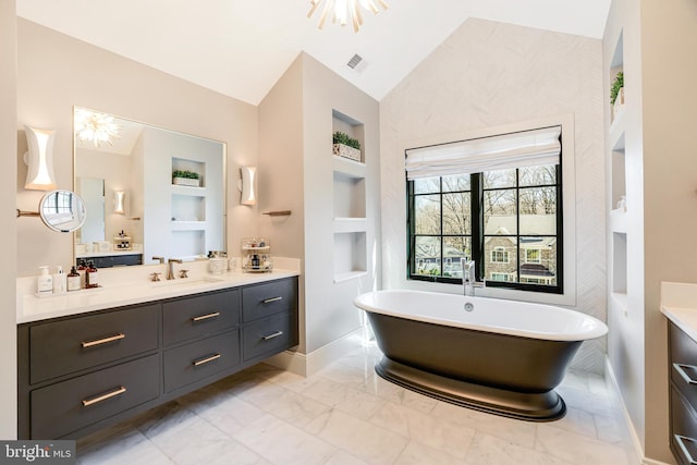 1544 Forest Villa Ln, Mclean, VA 22101 - full bath with baseboards, lofted ceiling, vanity, built in shelves, and a freestanding tub