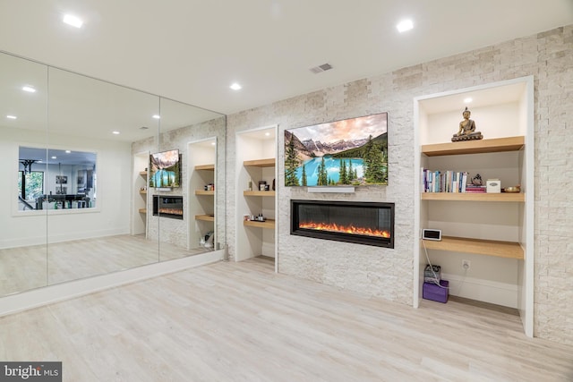 1544 Forest Villa Ln, Mclean, VA 22101 - living room with a glass covered fireplace, built in shelves, wood finished floors, baseboards, and recessed lighting
